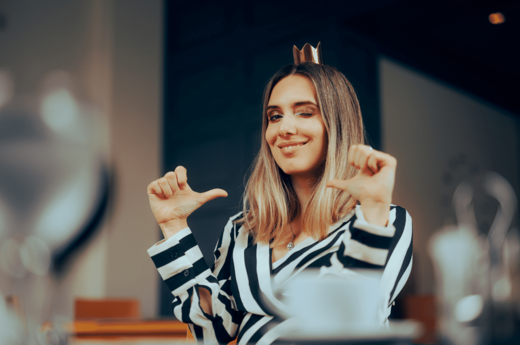 woman pointing at herself showing self love. celebrating a stress-free holiday in recovery