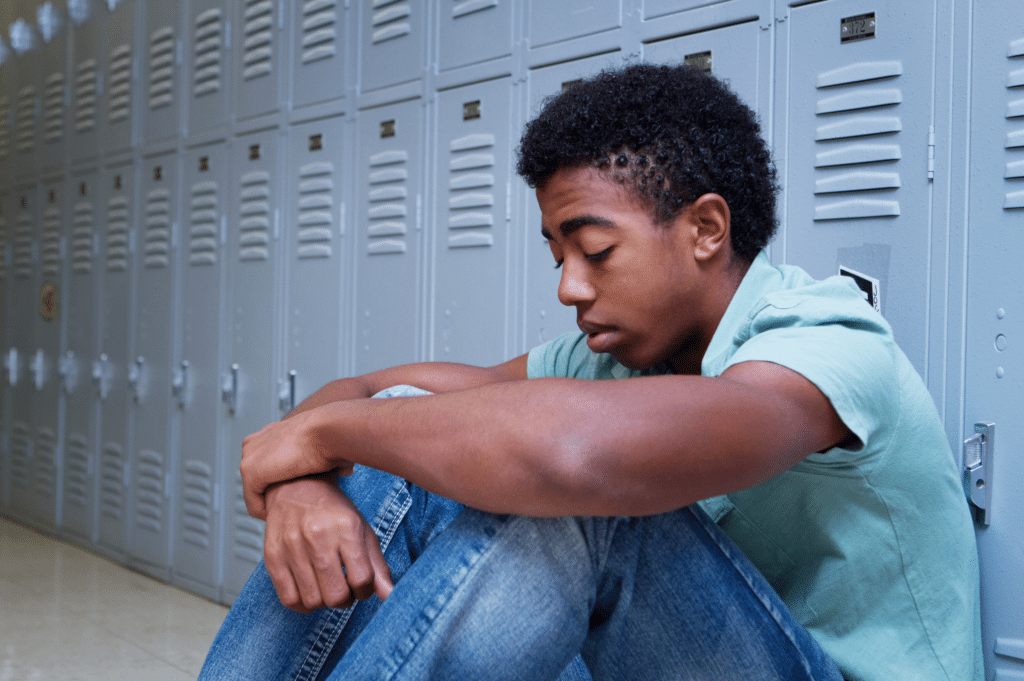 Teenager struggling with depression after being exposed to substance use at home.