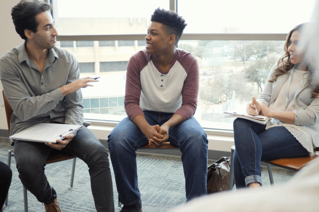teens attending group therapy