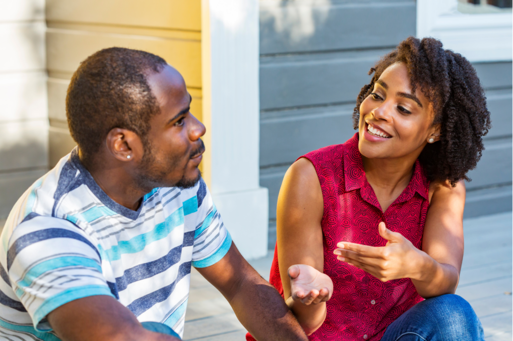 Woman talking to her loved one who is in recovery about how she is going to support him.